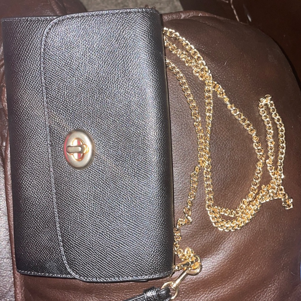 Coach clutch/crossbody with gold chain.